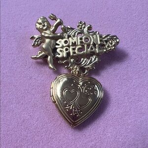 Gold Heart Brooch with Cherub Design